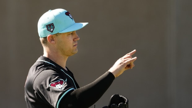 Arizona Diamondbacks closer Paul Sewald (38) gestures while throwing a bullpen session at Salt River Fields.
